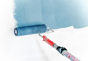 roller placing blue paint