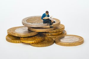 guy sitting on coins